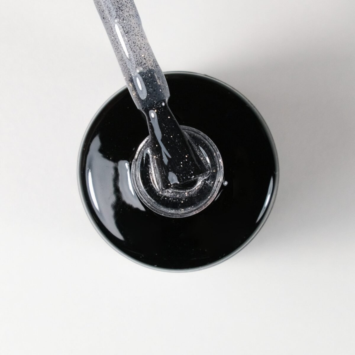Gaismu atstarojoša gēla lakas virskārta (top coat), bez lipīguma "Flash" top silver, 12ml - Image 2
